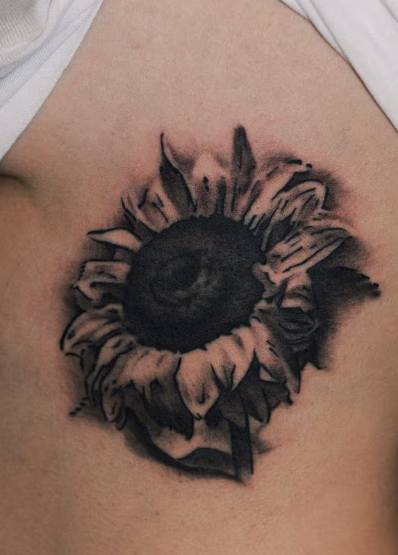 black and grey sunflower flower tattoo