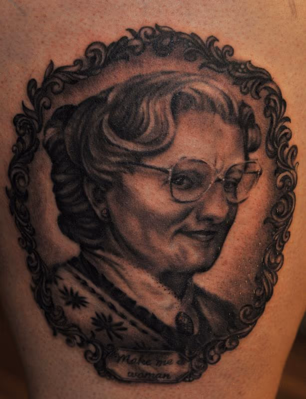 Mrs. Doubtfire black and grey portrait tattoo