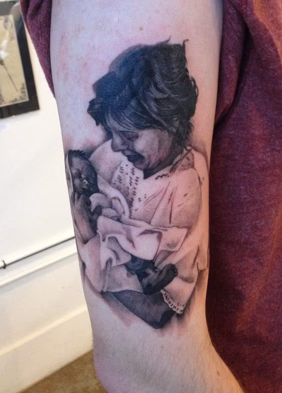 Mother and baby portrait tattoo
