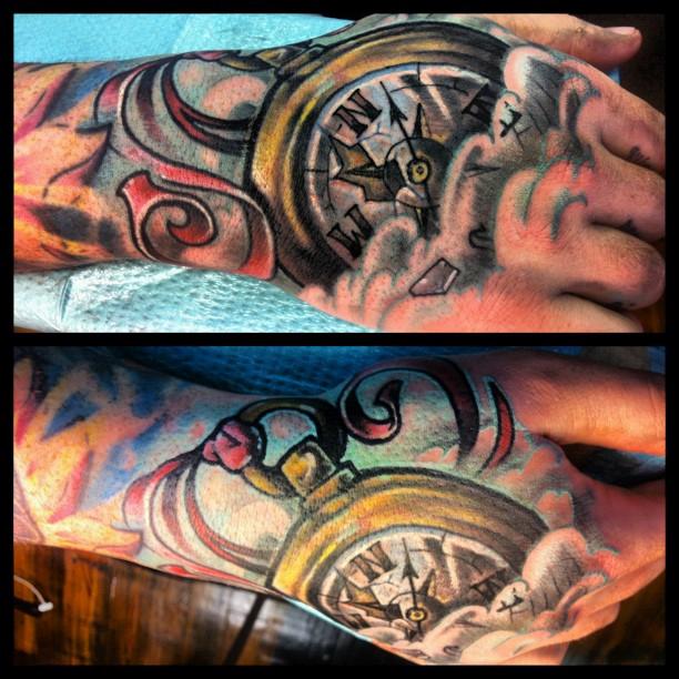 Compass hand tattoo