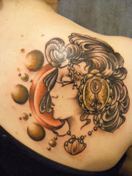 Pinup shoulder tattoo