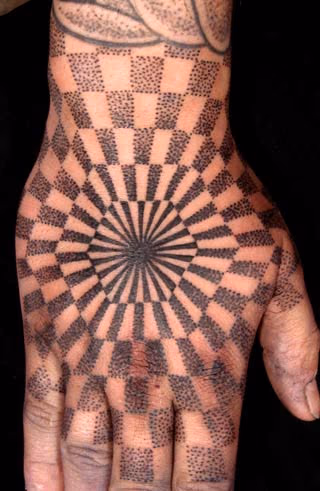 Optical illusion hand tattoo