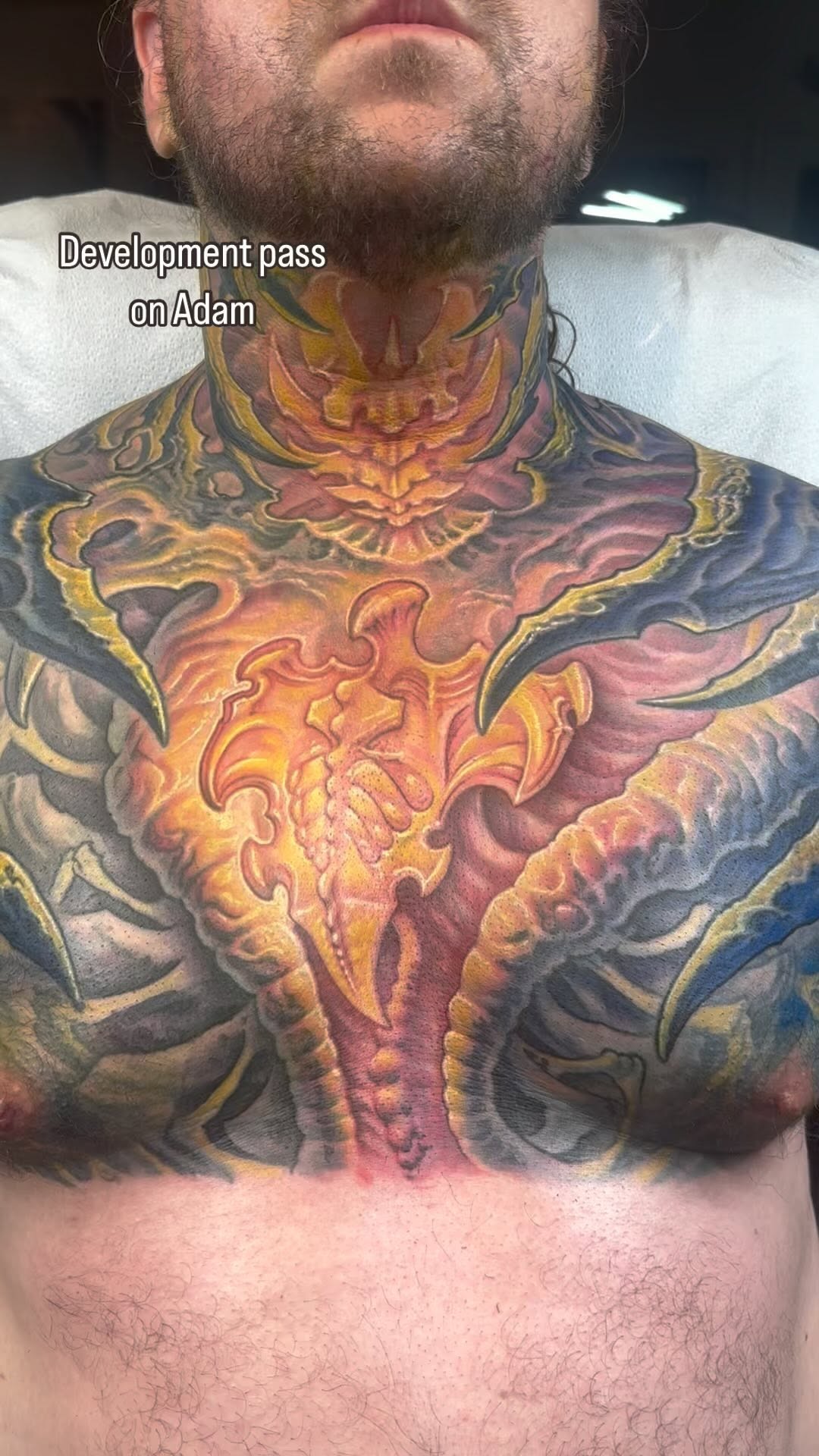 Biomechanical chest and neck tattoo in color