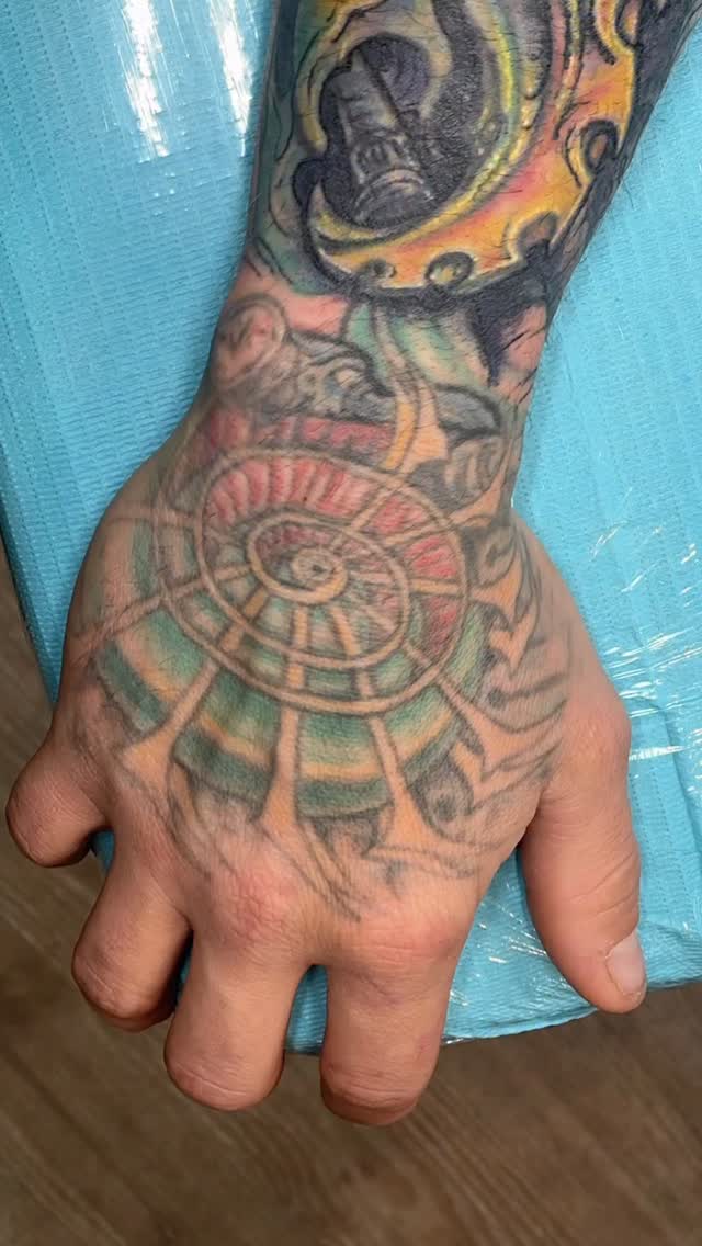 Color ship wheel and lighthouse hand tattoo