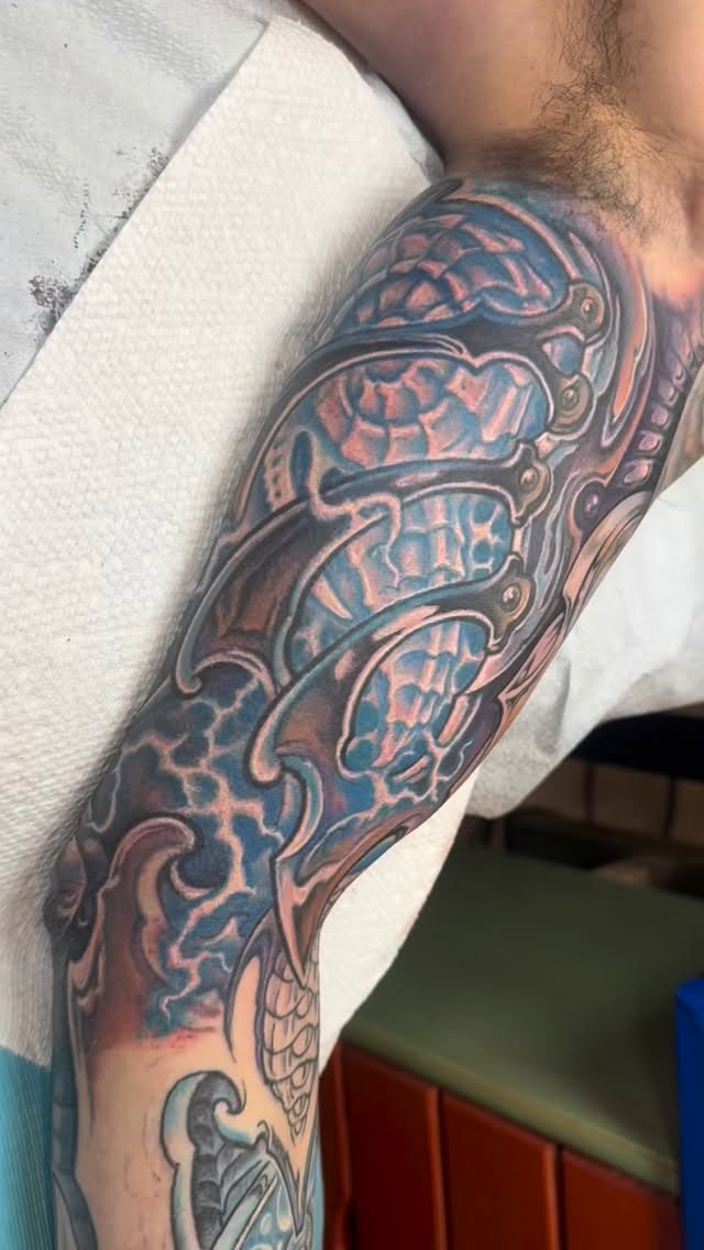 Biomechanical armor sleeve in blue and pink