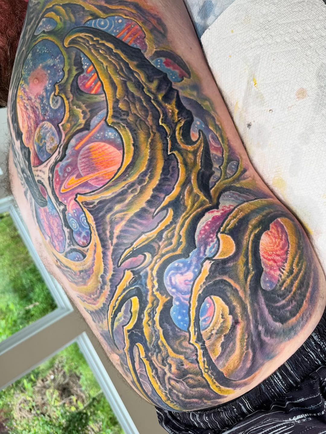 Biomechanical cosmic sleeve with planets, thigh