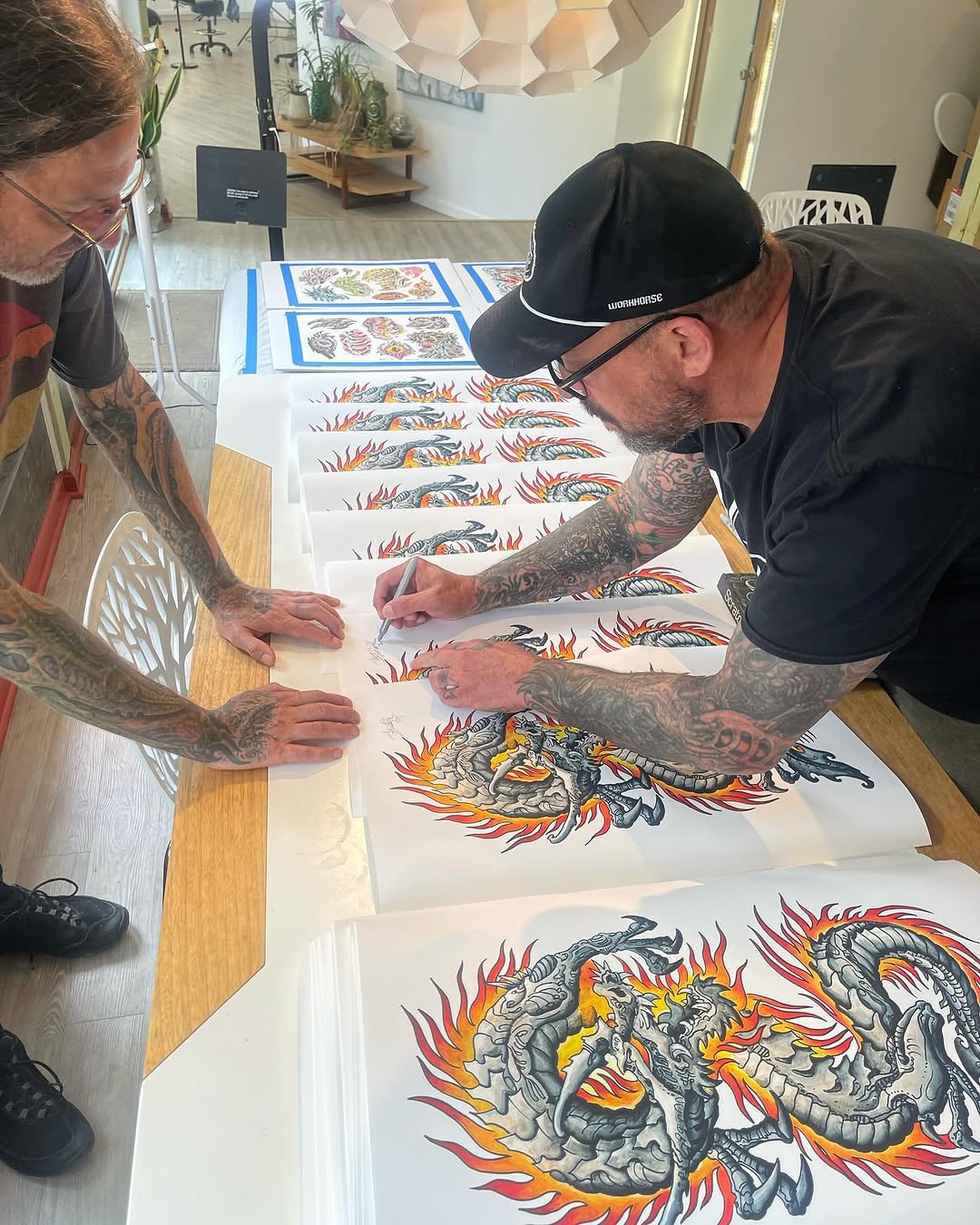 Artists signing dragon flash print collaboration