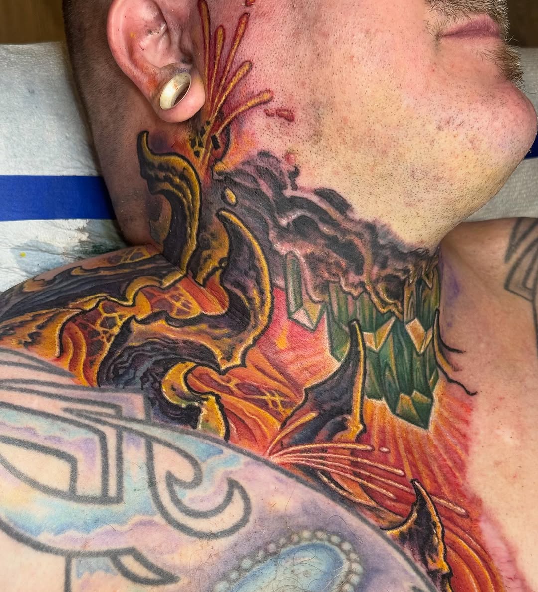 Biomechanical crystal lava neck tattoo in color