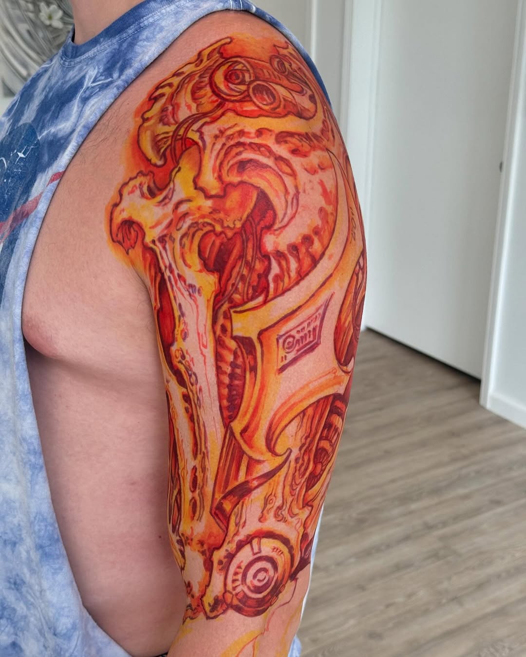 Biomechanical half-sleeve in fiery orange and red