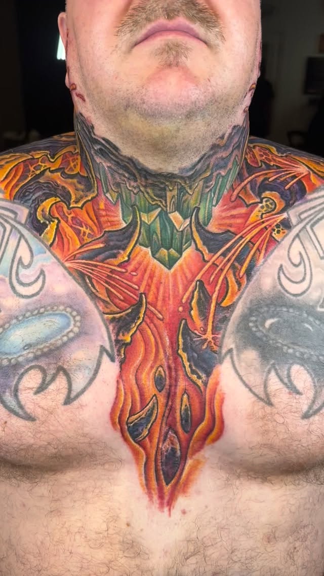 Biomechanical neck and chest tattoo in color