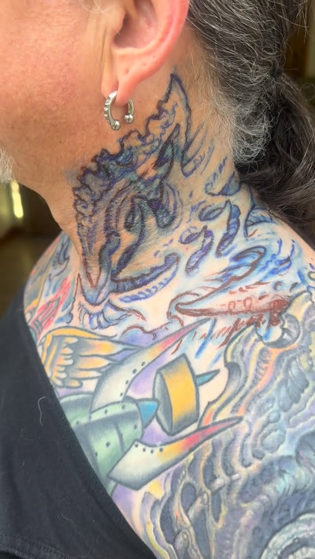 Color dragon neck tattoo in progress