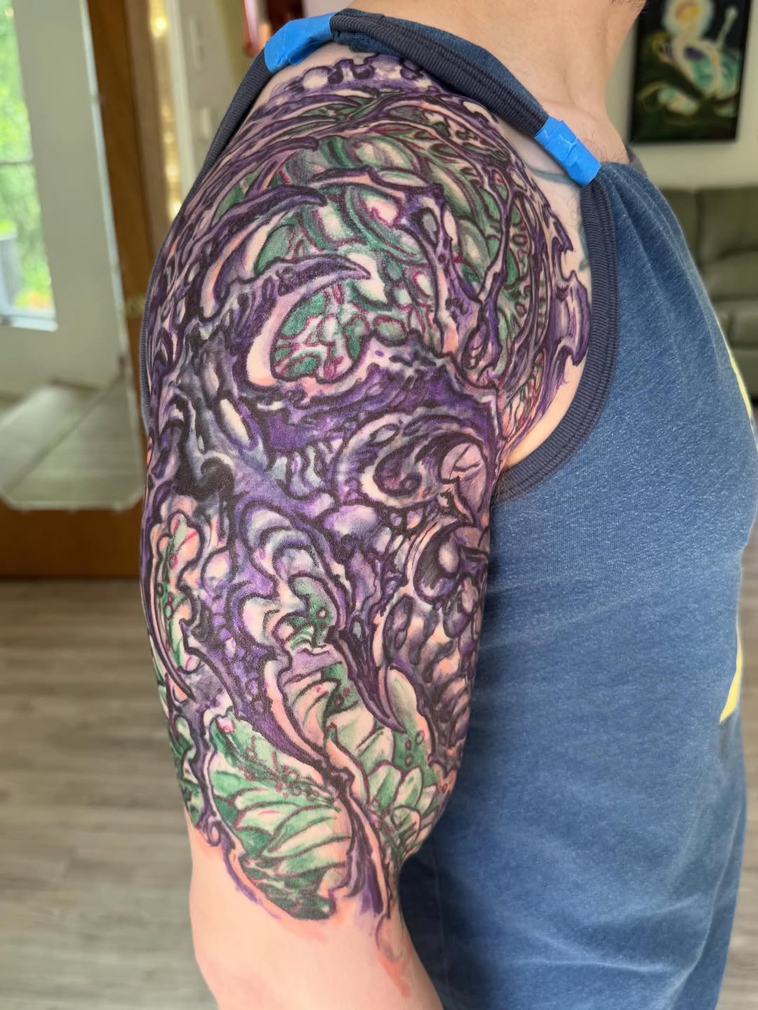 Biomechanical half-sleeve coverup in purple and green