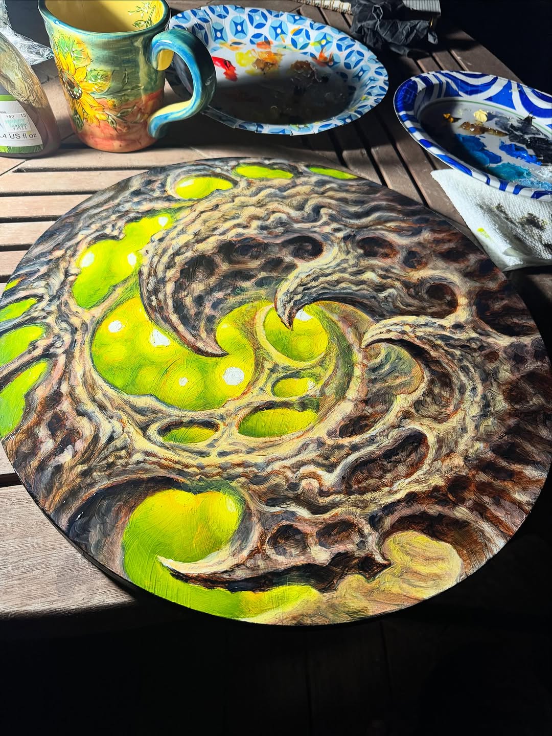 Biomechanical green abstract oil painting on round panel