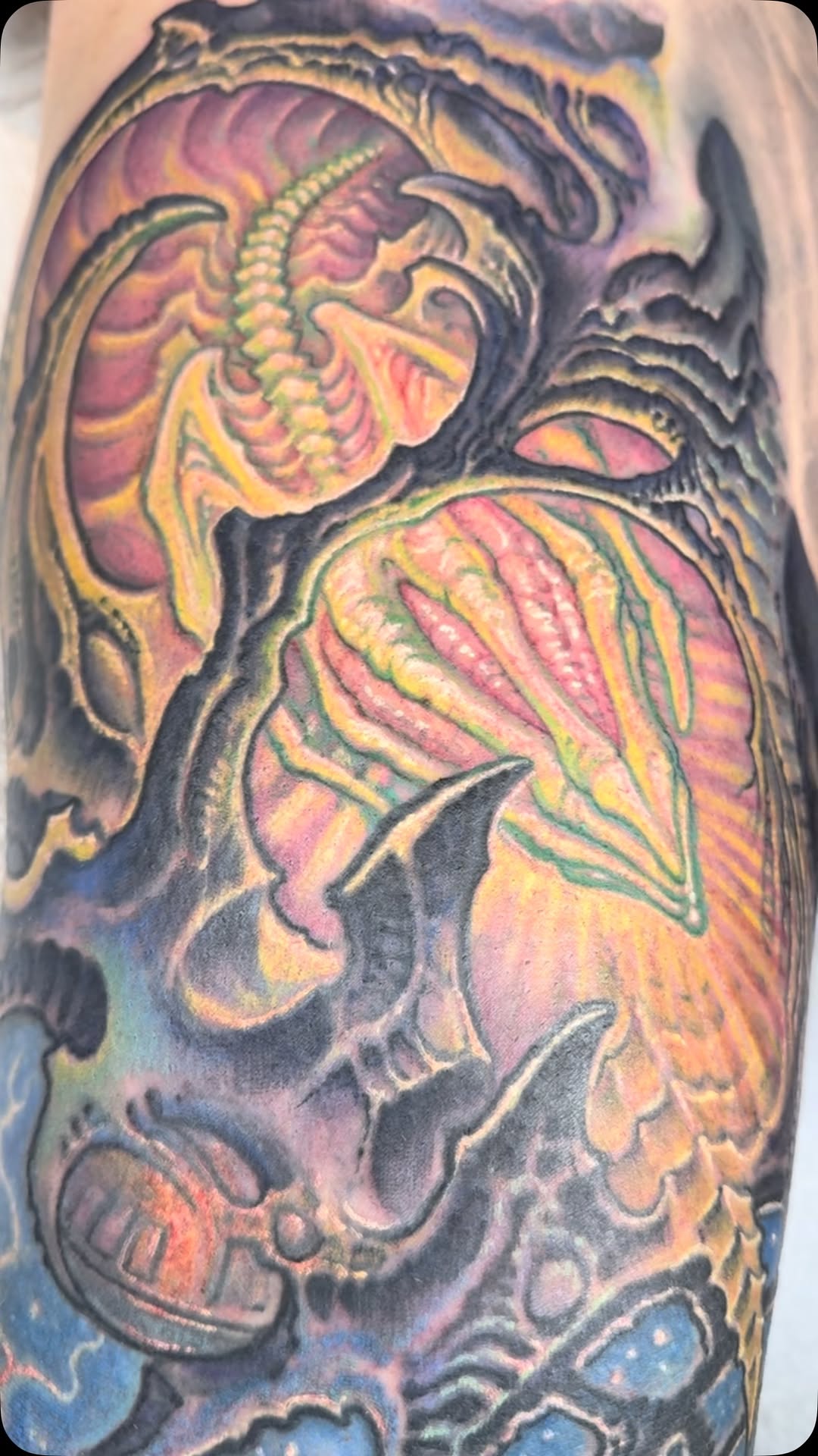 Biomechanical Alien color tattoo on arm