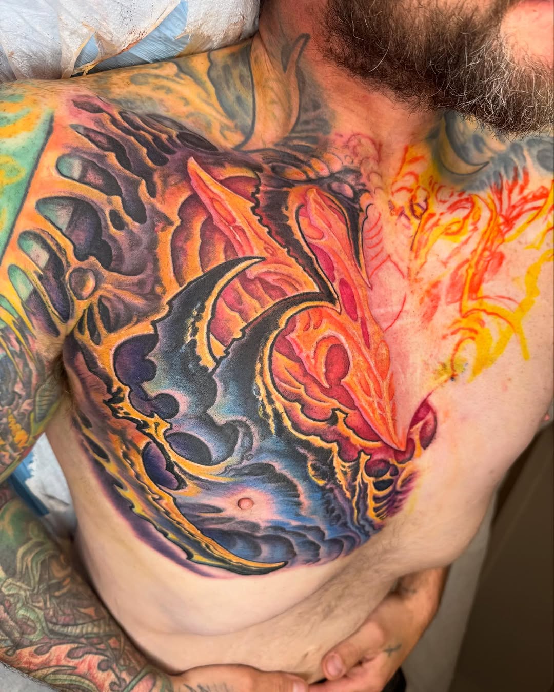 Biomechanical chest tattoo in vivid color