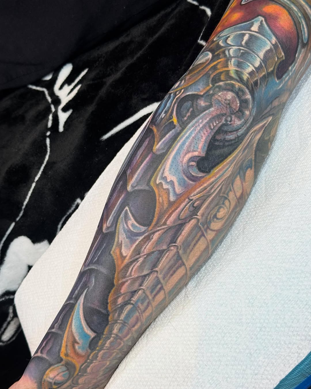 Biomechanical chrome armor sleeve in color