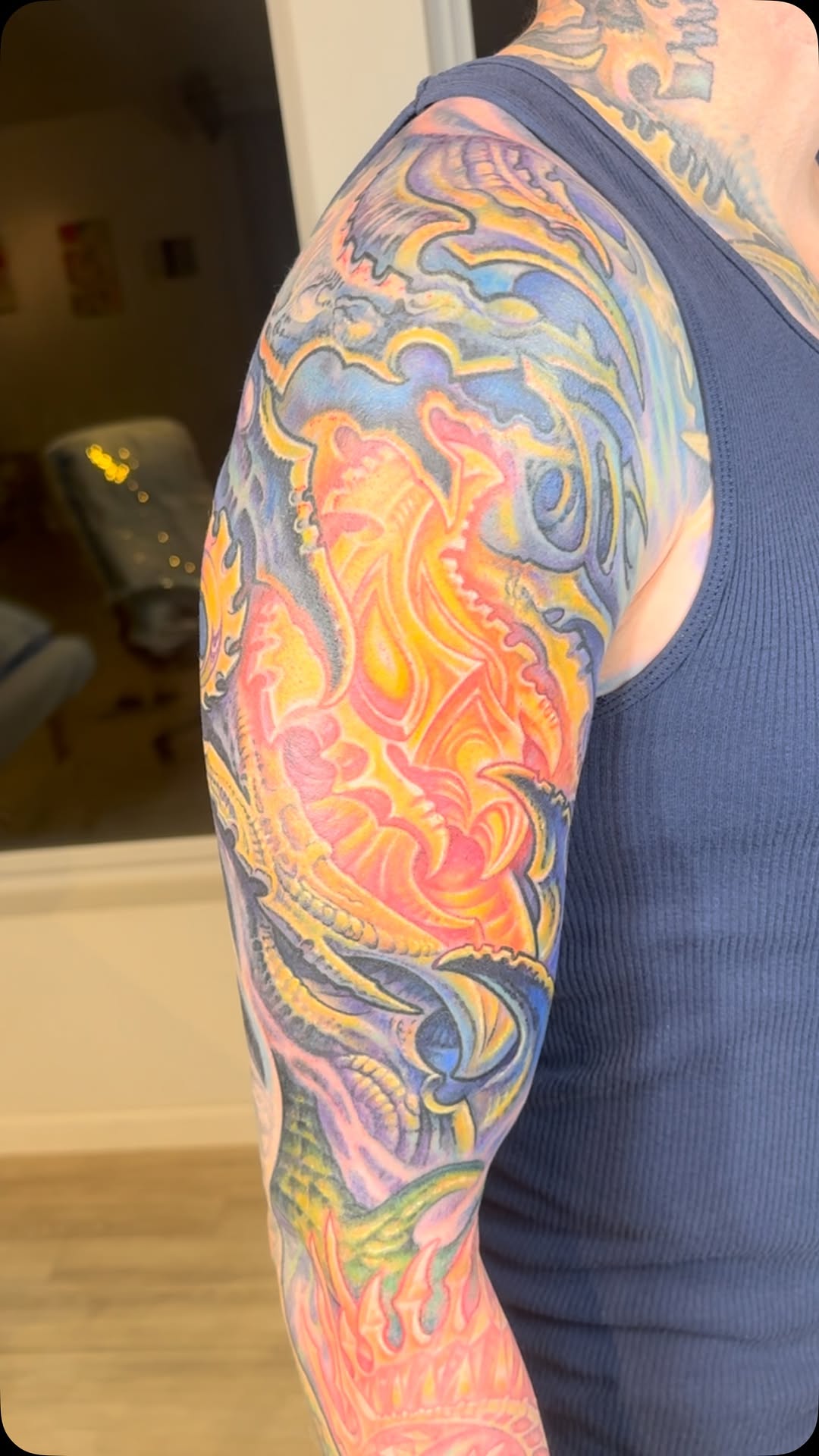 Color biomechanical full sleeve tattoo