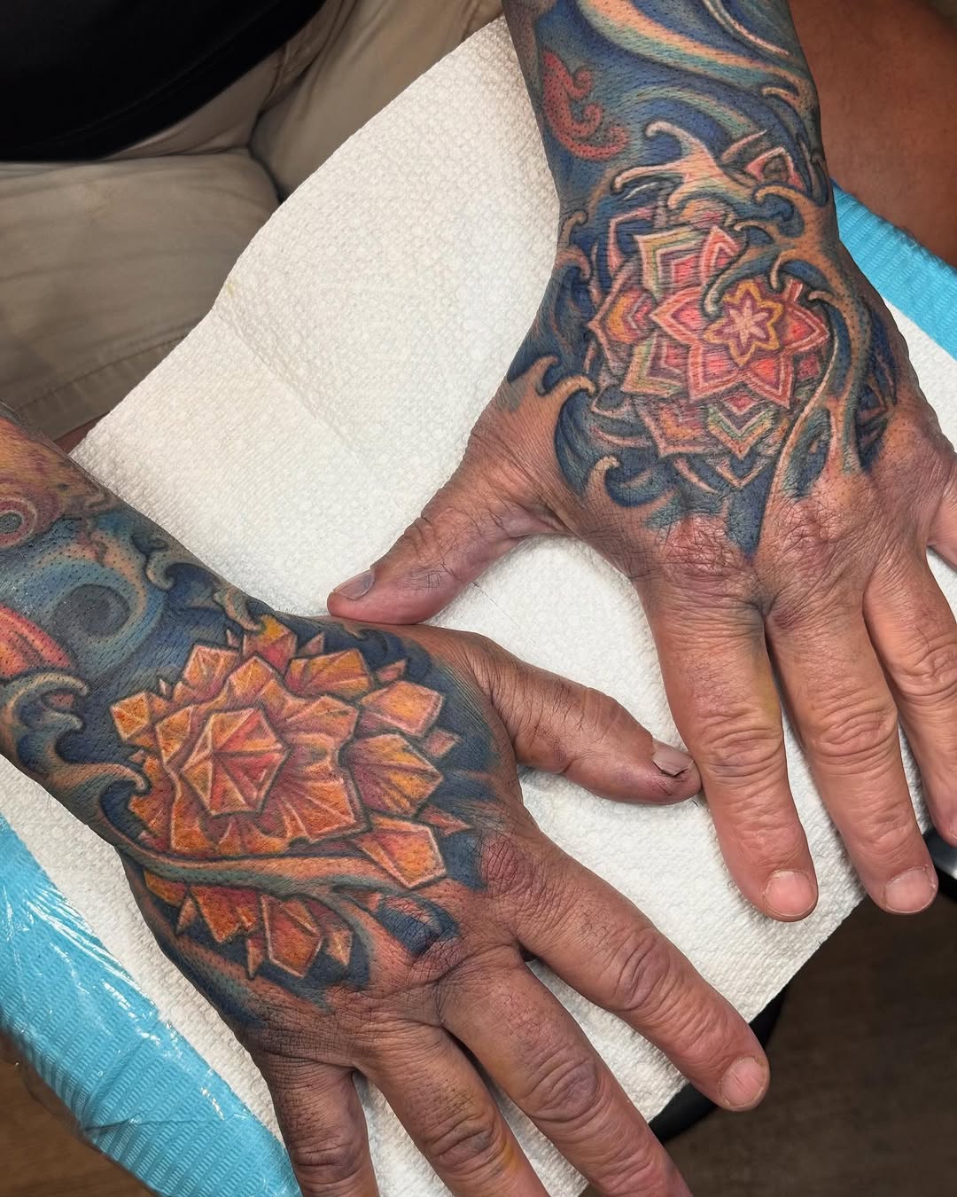 Color mandala hand tattoos, collaborative pair