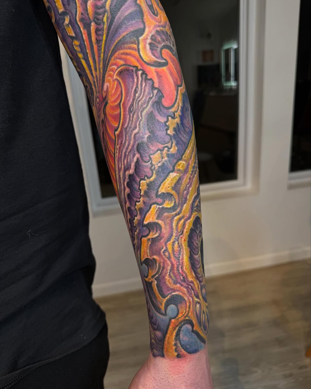 Biomechanical color sleeve in purple and orange