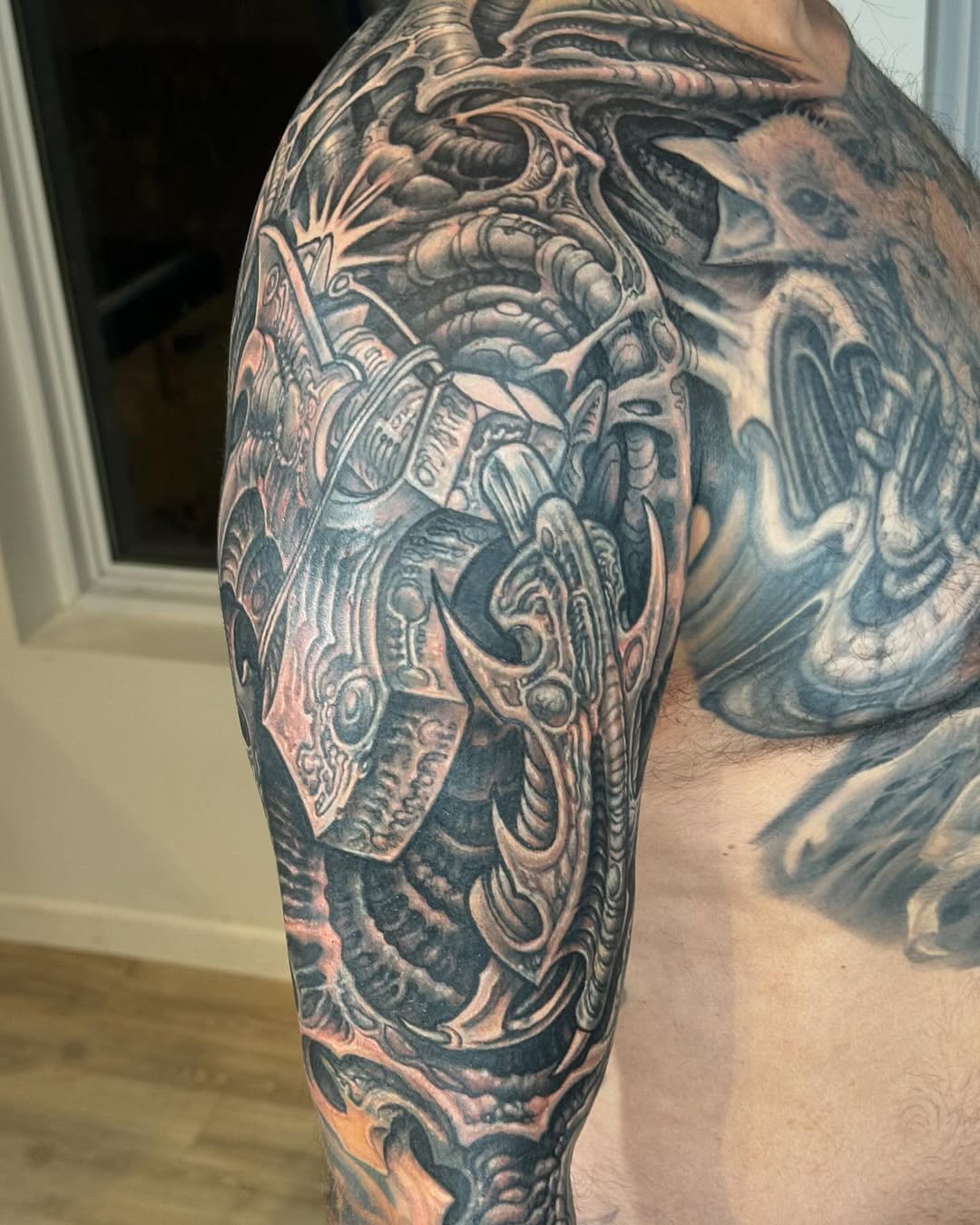 Biomechanical black-and-grey sleeve coverup