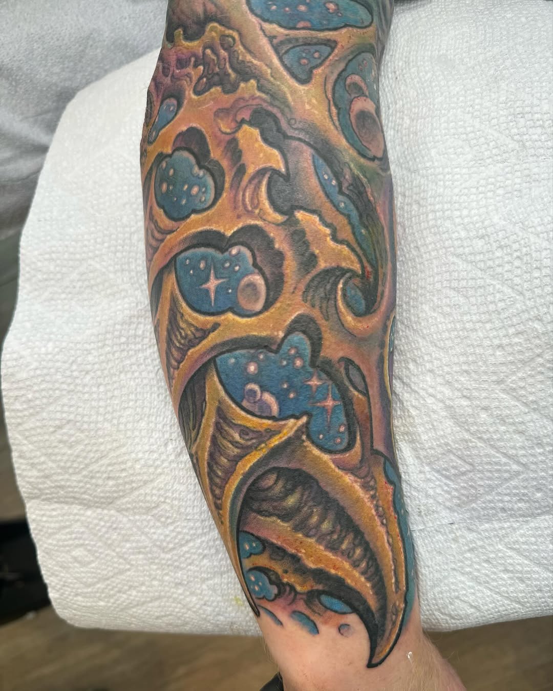 Biomechanical cosmic sleeve in color, forearm