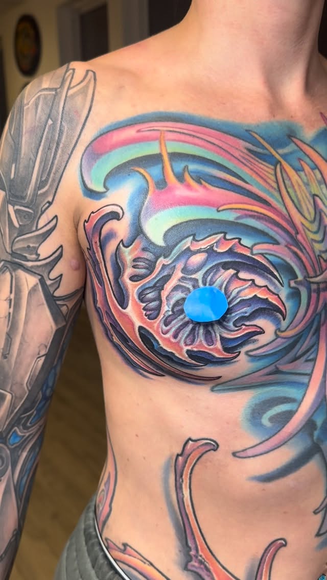 Biomechanical color chest tattoo