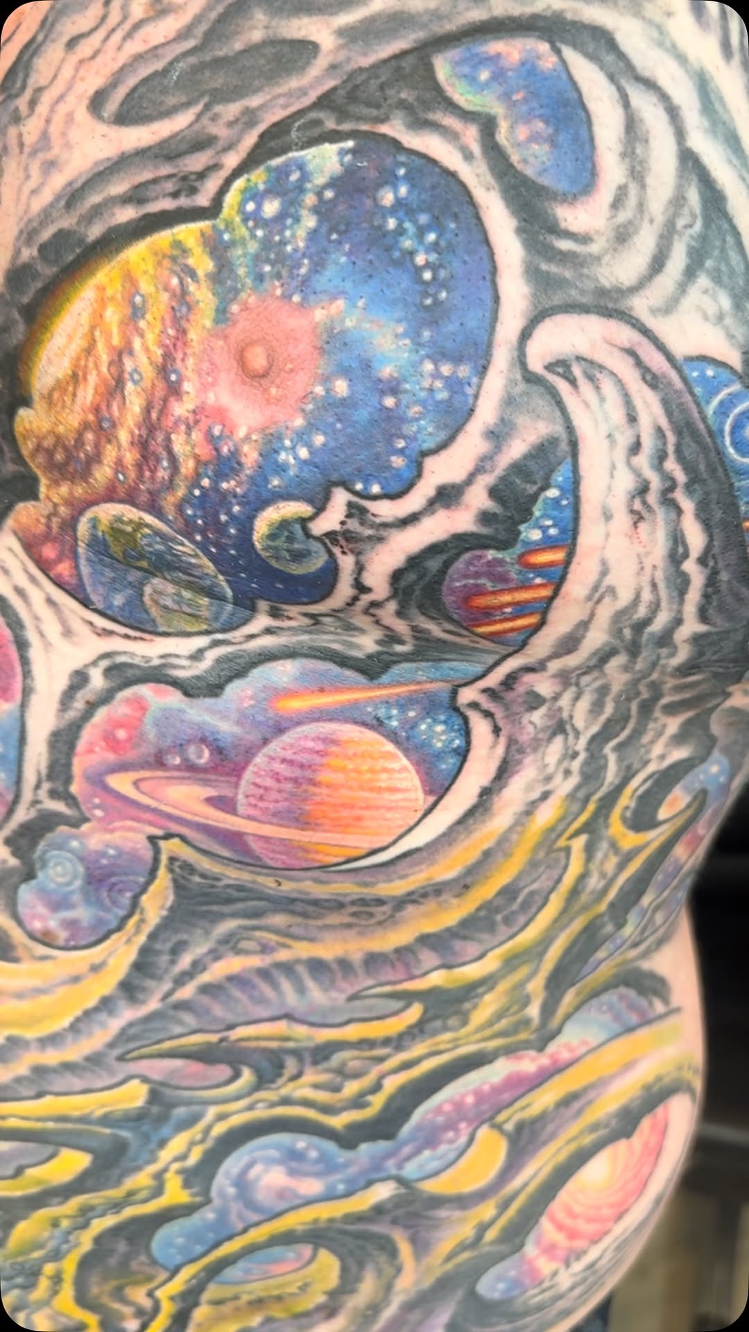 Color space biomechanical tattoo with planets