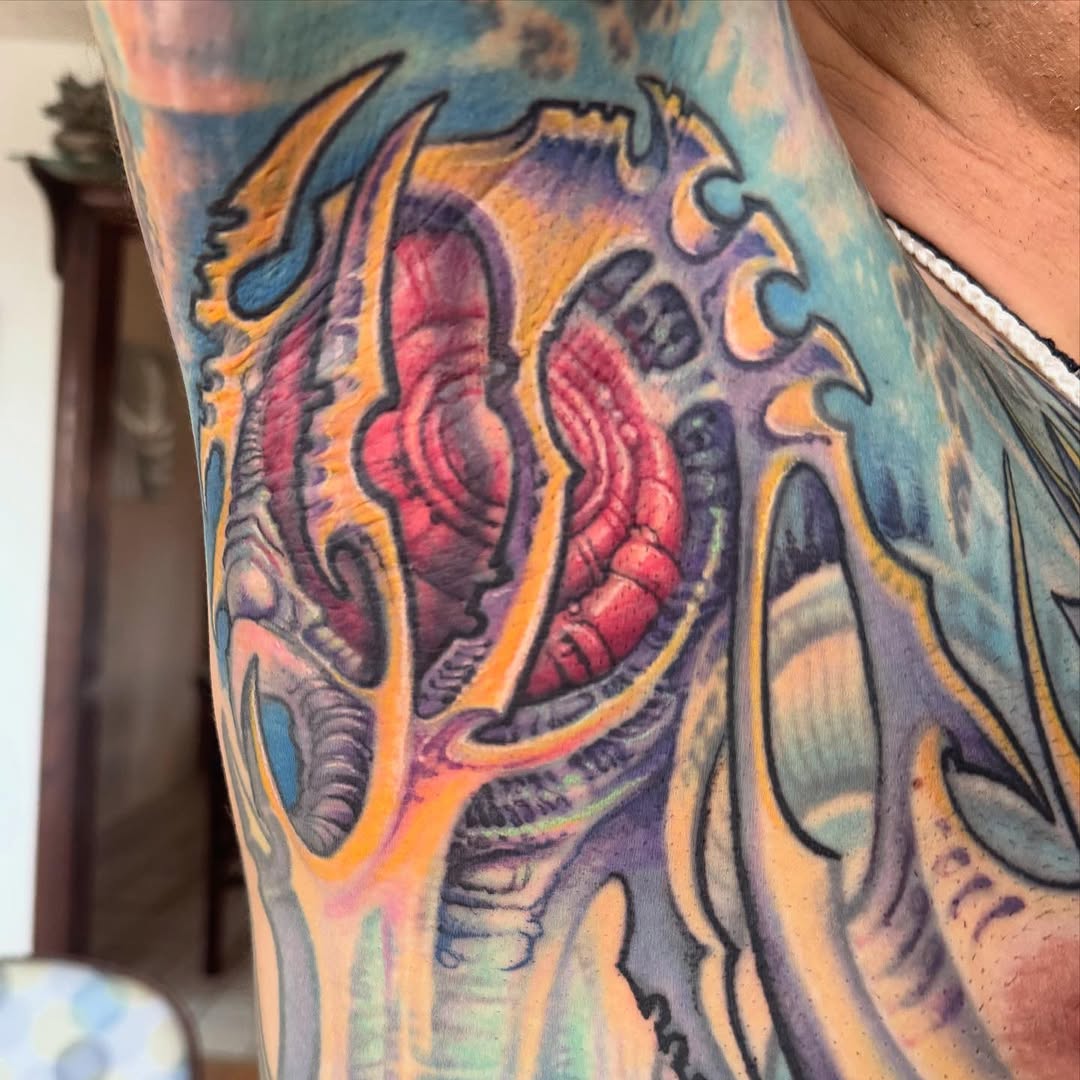 Biomechanical color tattoo, arm and chest