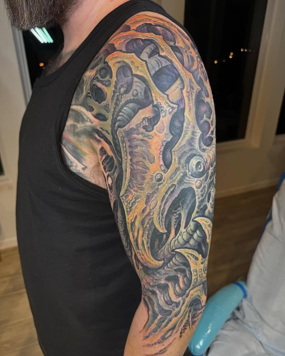 Biomechanical color half-sleeve in orange and purple