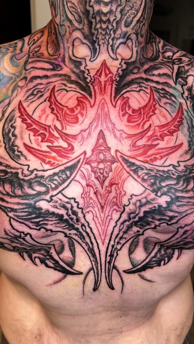 Biomechanical chest and neck piece in red and black