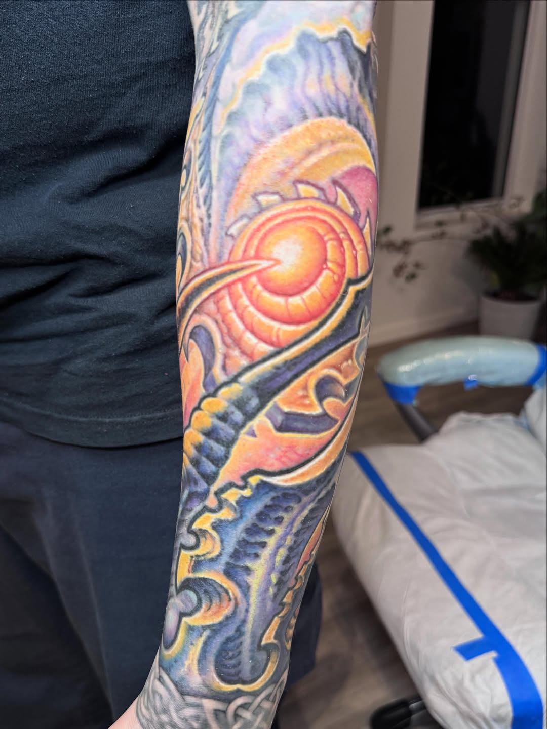 Colorful celestial eye forearm tattoo coverup