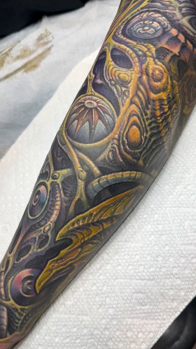 Biomechanical color coverup sleeve with skulls