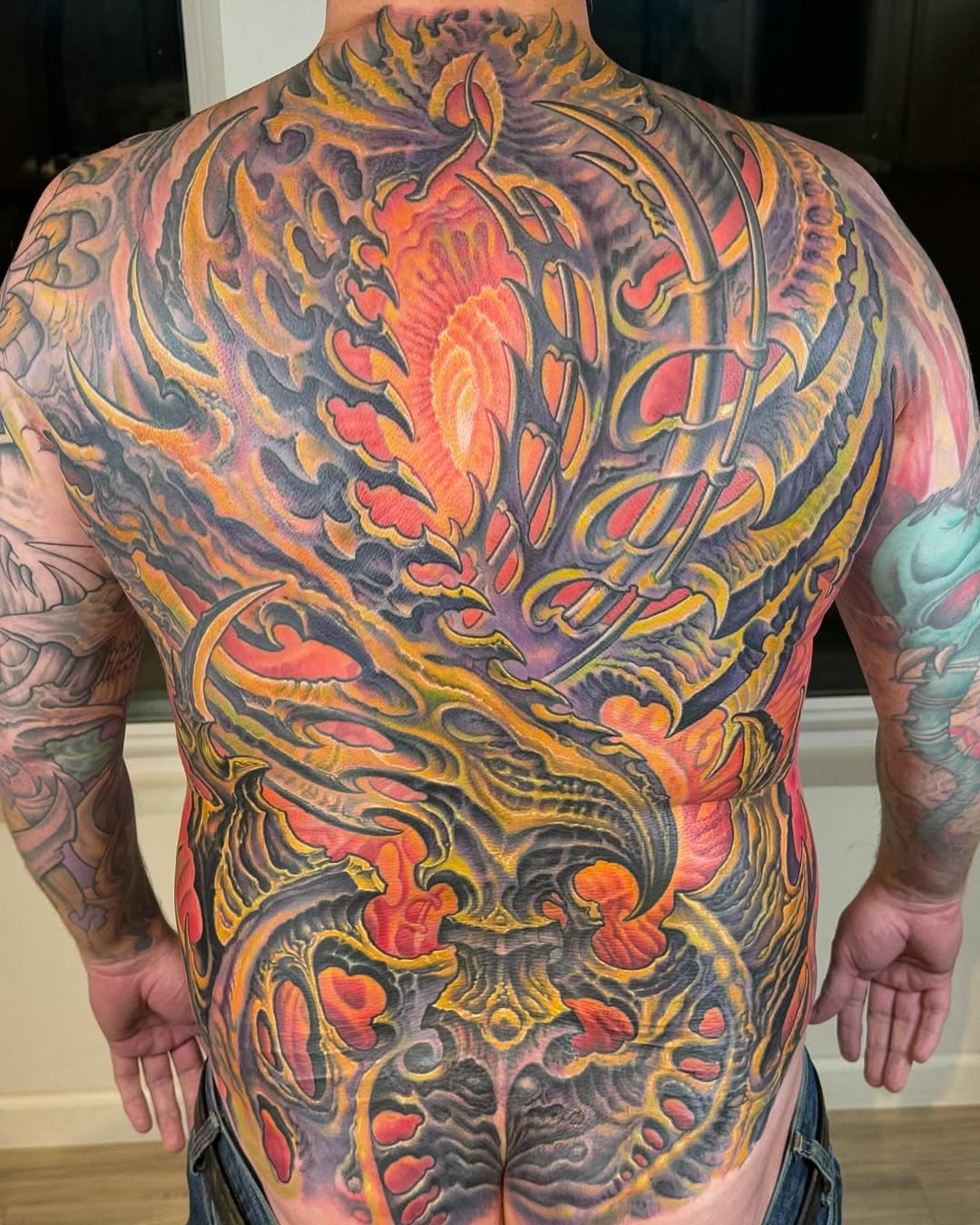 Biomechanical full-back piece in color