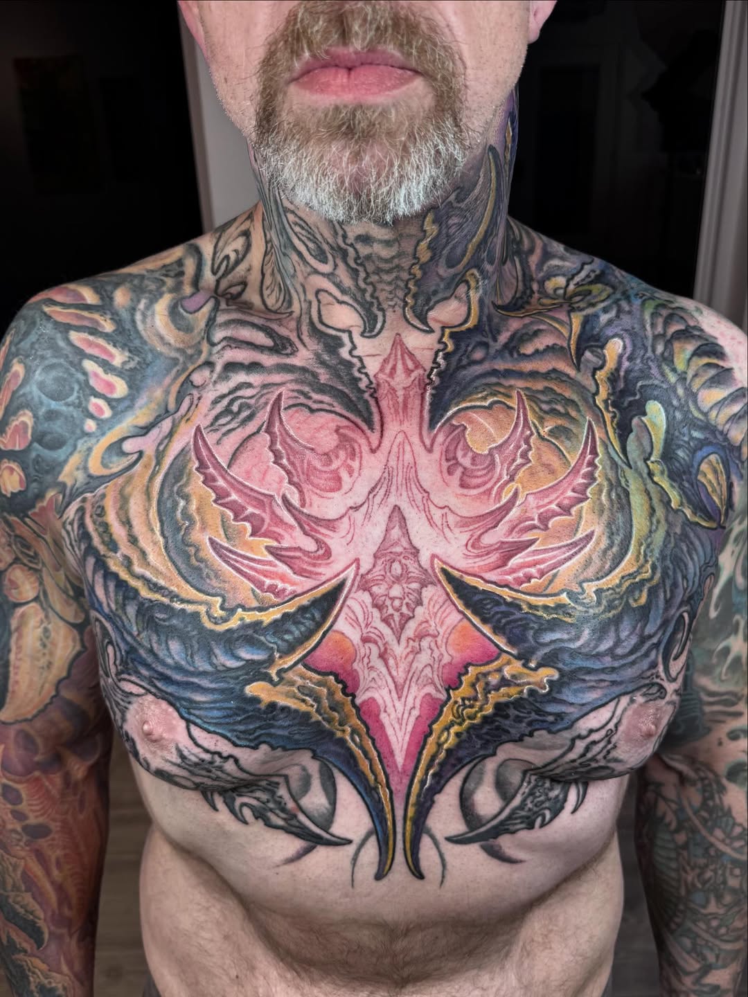Biomechanical chest and neck tattoo in color