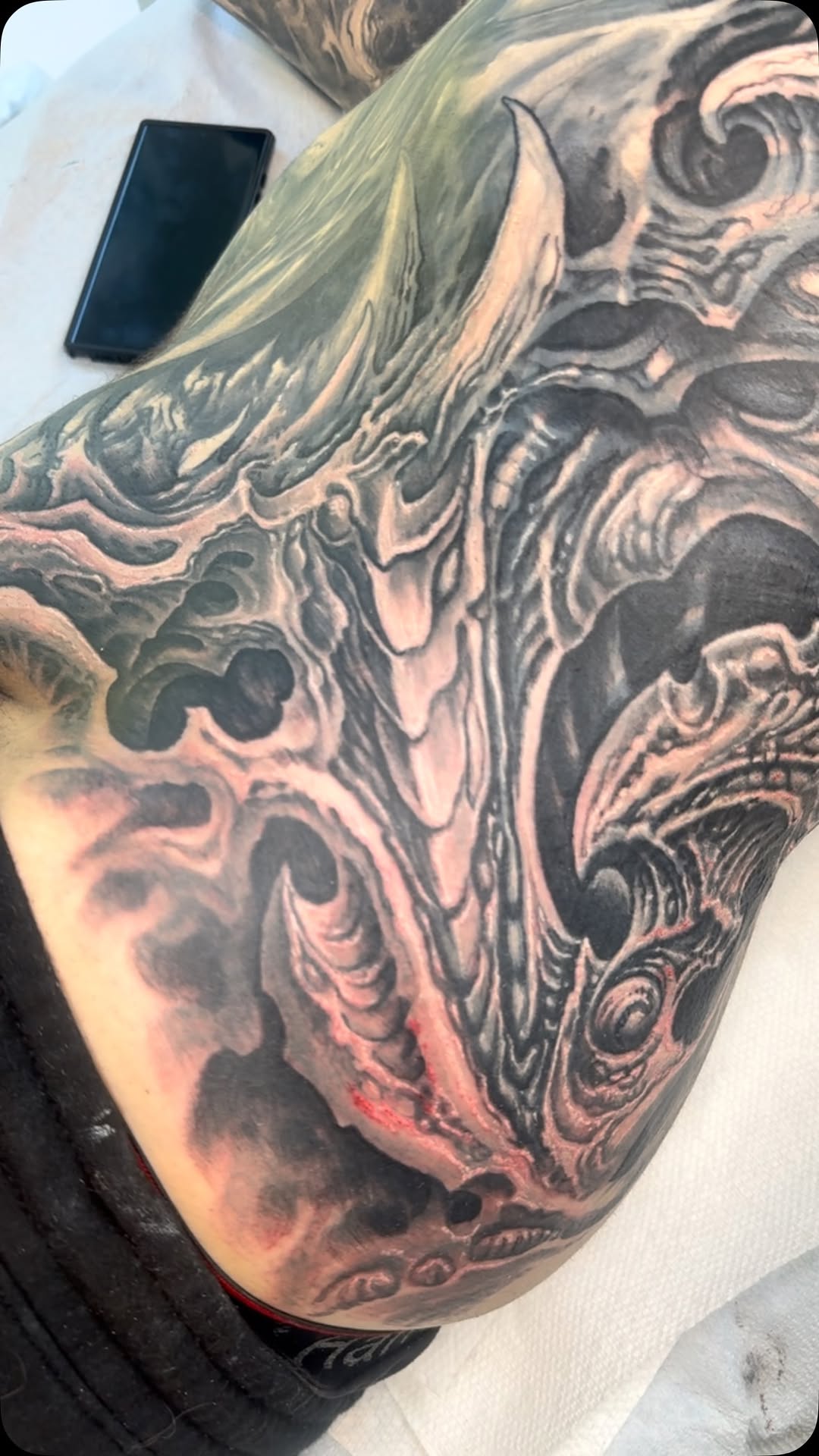 Biomechanical black-and-grey cover-up sleeve