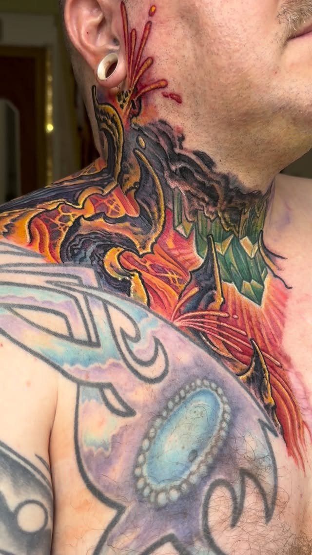 Biomechanical neck and chest tattoo in color
