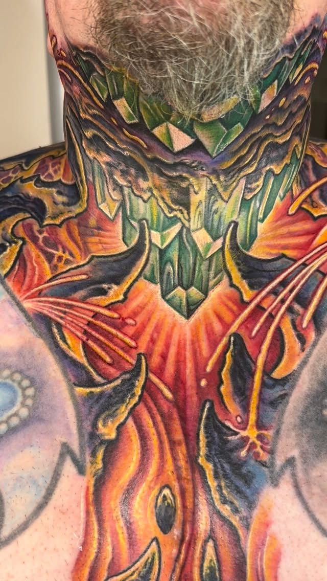 Biomechanical neck and chest tattoo in color