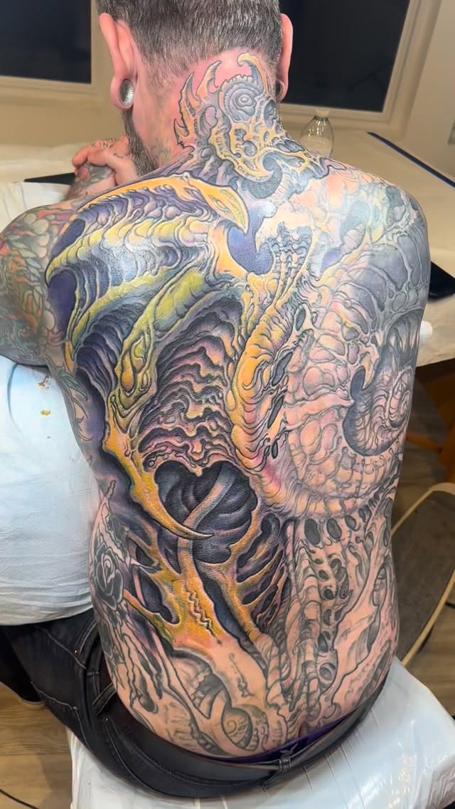 Biomechanical full-back coverup in color