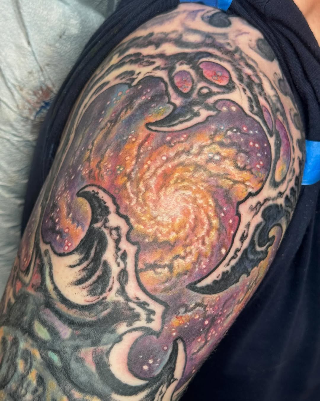 Biomechanical galaxy tattoo, upper arm