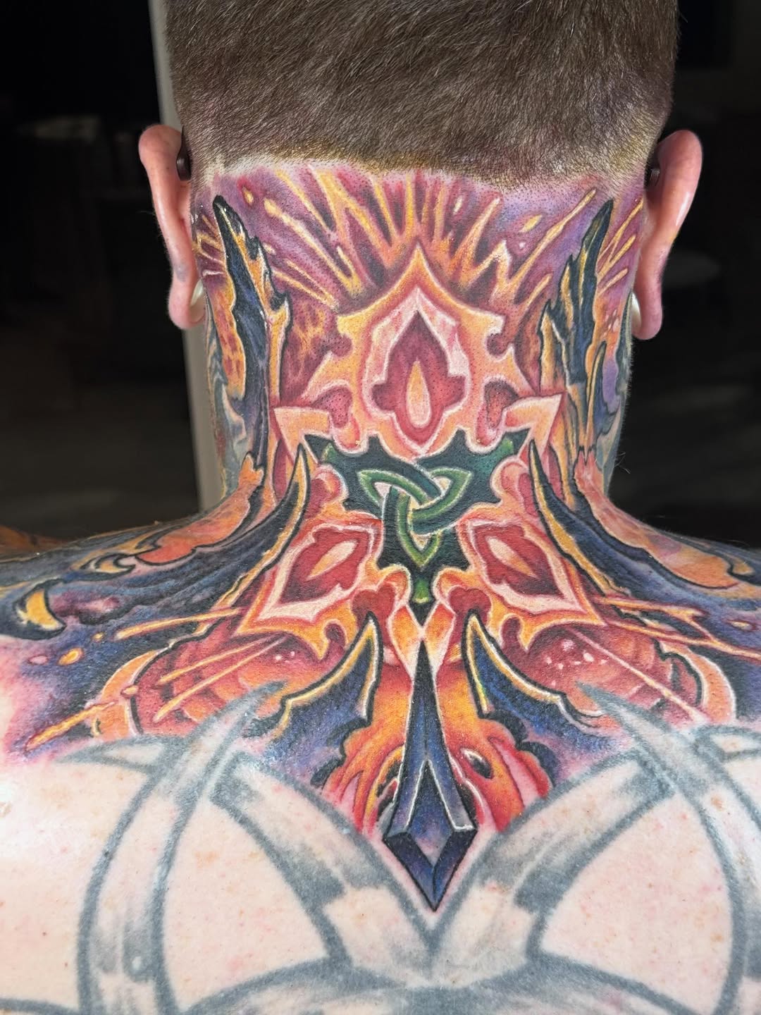 Biomechanical color neck tattoo