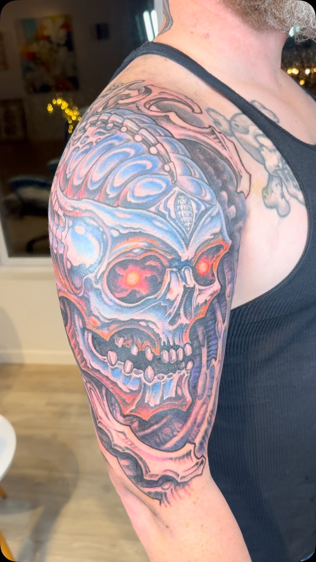 Biomechanical chrome skull half-sleeve in color