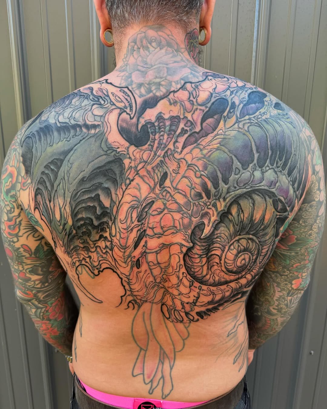 Biomechanical back-piece coverup in progress