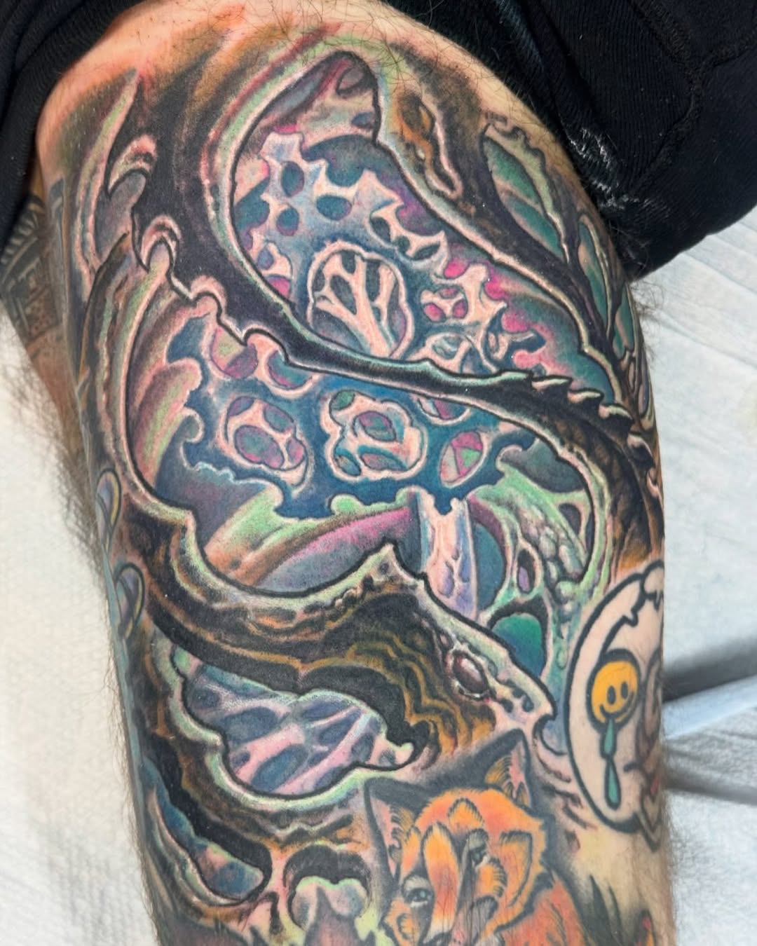 Color biomechanical fungus tattoo on thigh