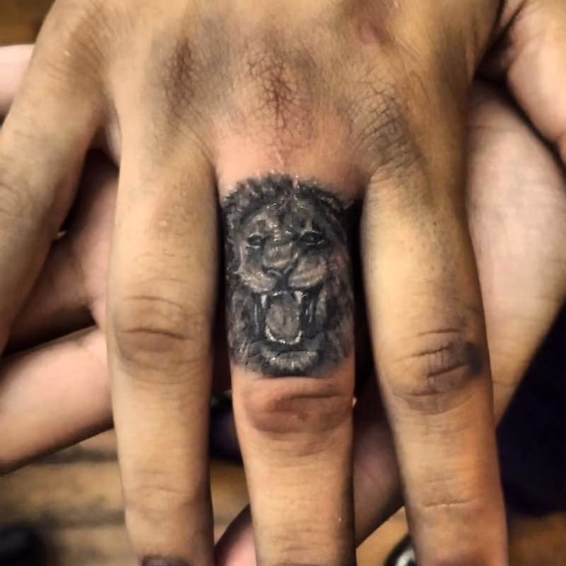 lion finger tattoo