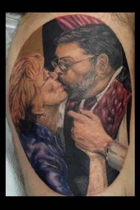 a tattoo portrait of a mom and dad