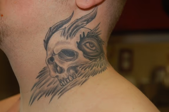 Skull on Neck Tattoo