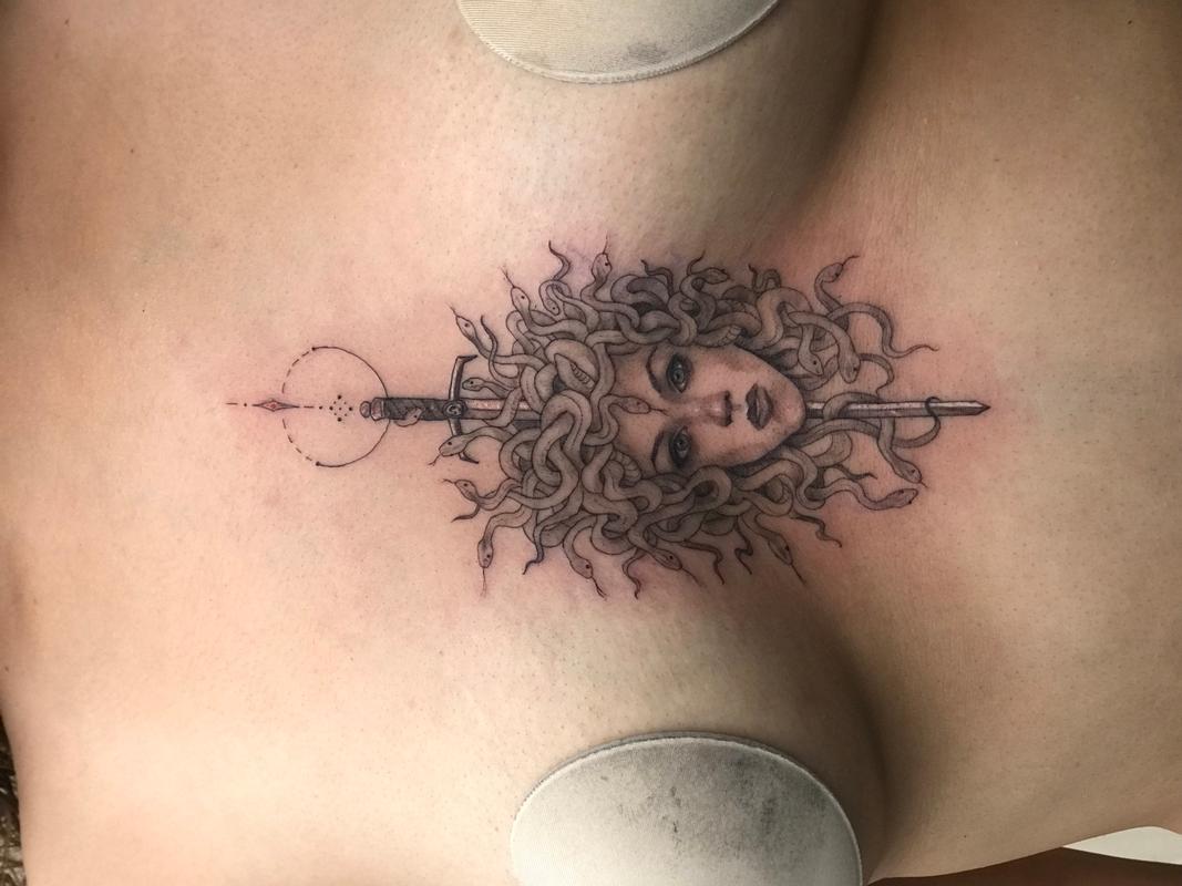 Medusa sternum tattoo