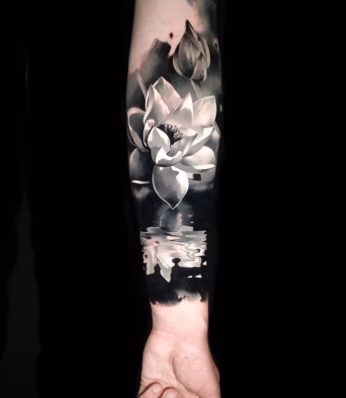 Lotus with reflection tattoo