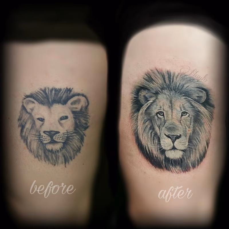 Realistic lion cover up tattoo
