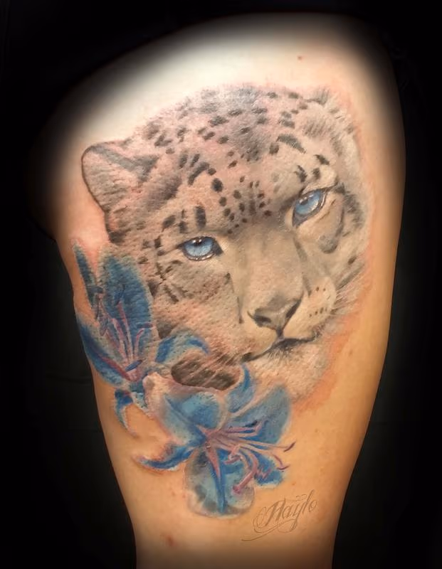 Snow Leopard with blue lilies